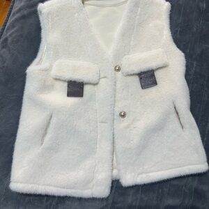 Vest cream-colored with gold buttons and pockets. Size Large